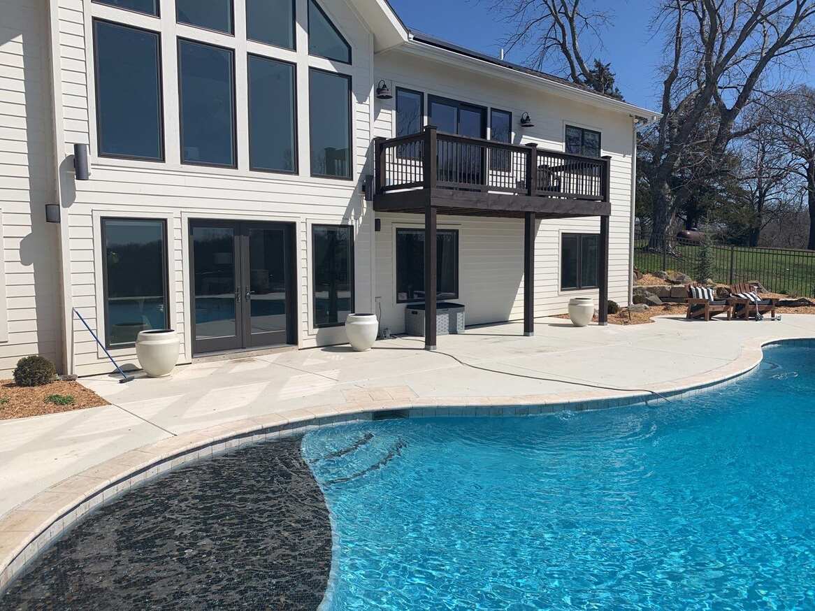 Newly Painted House Exterior with Pool on the Side