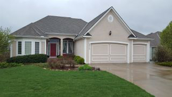 A house with garage and driveway- Lawrence, KS House Painters